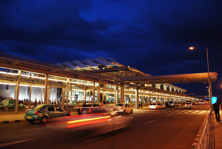 Airport rental car lot with vehicles equipped with GPS trackers