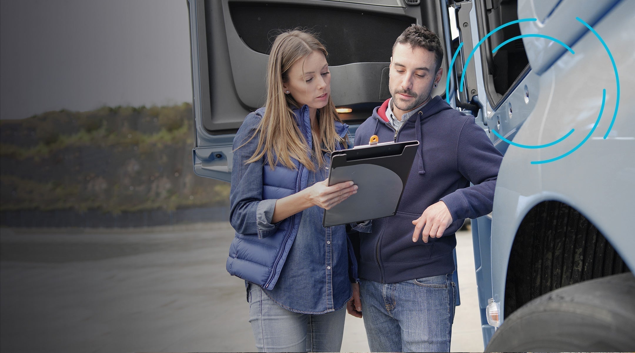 Image of two workers next to a truck equipped with GPS tracking