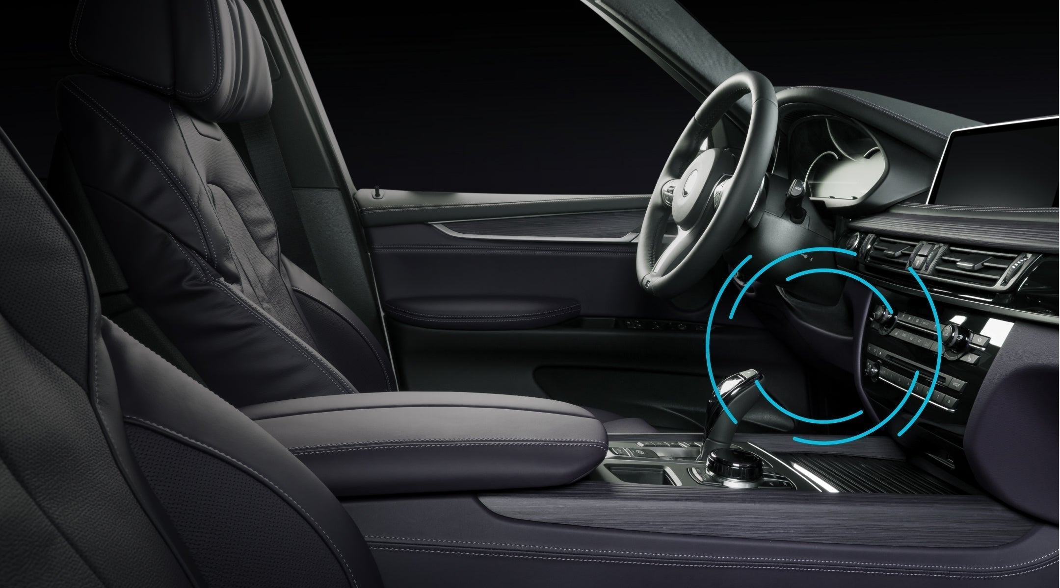 Image of a car interior with a GPS OBD tracker installed