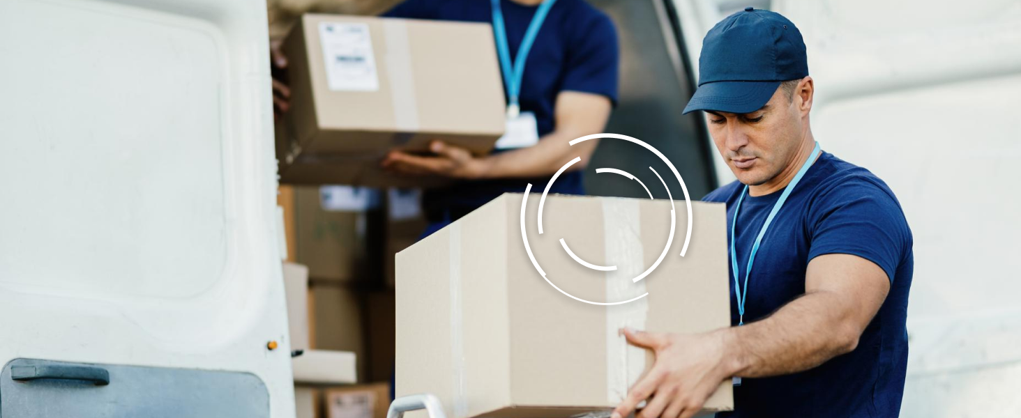 Image of worker moving boxes with a GPS tracker attached